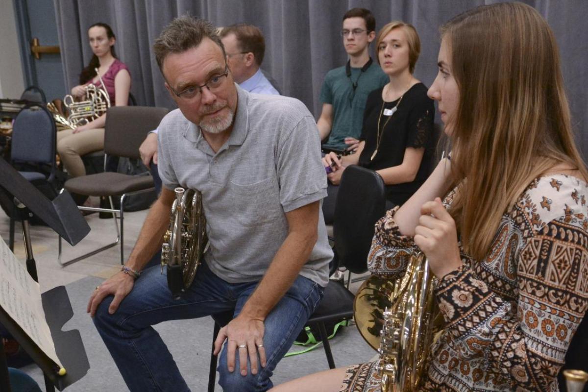 Students and instructor talking during class