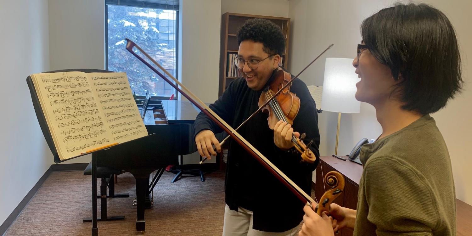Assistant Professor of Violin Alex Gonzalez and student Eli Pouliot