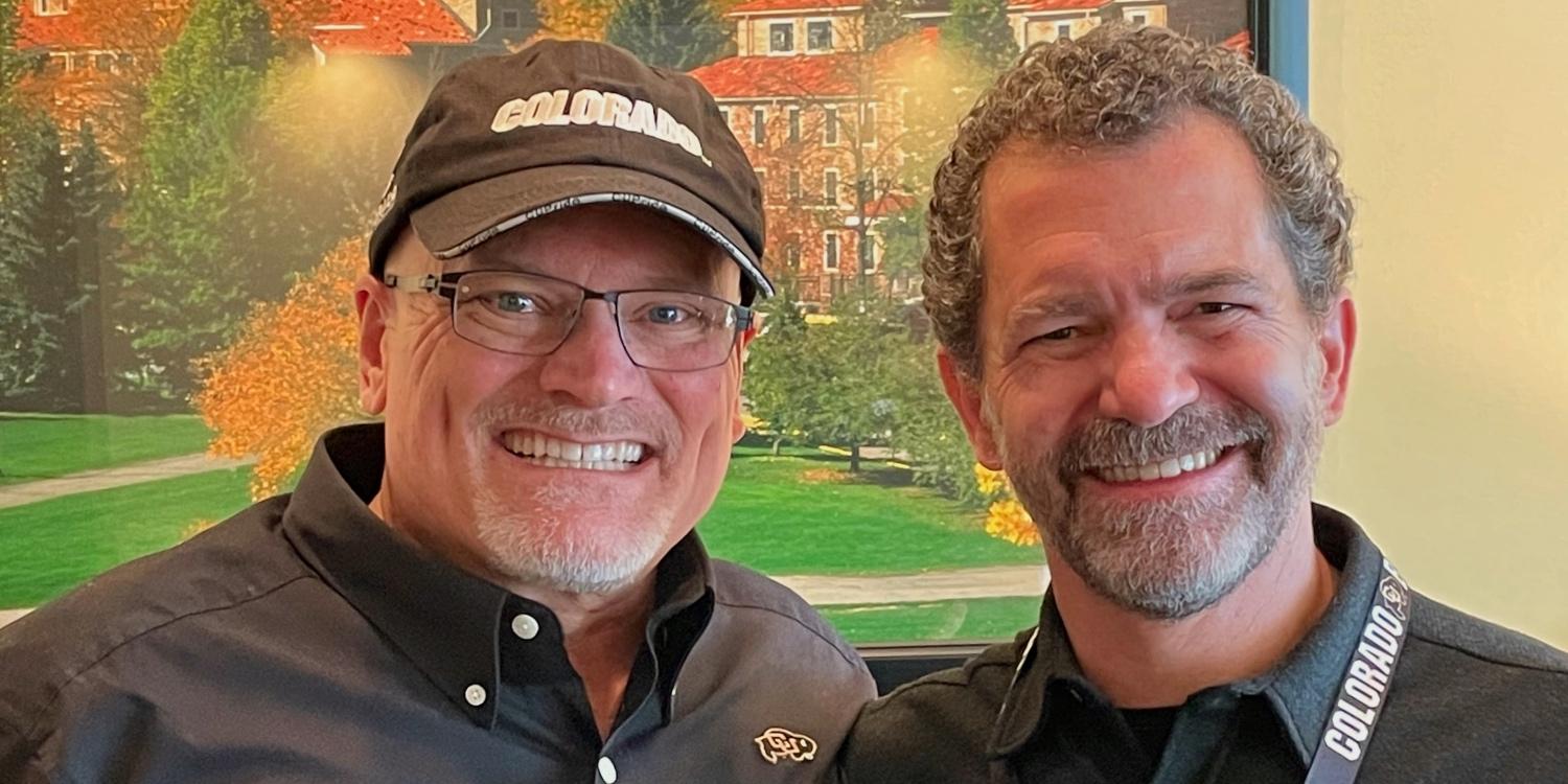 Dean John Davis and CU President Todd Saliman show their school spirit at Saturday’s final home game.