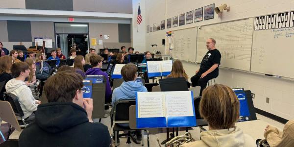 McKee speaks with the Indianola High School Wind Ensemble sharing stories and life advice. Photo courtesy: Indianola High School Band.