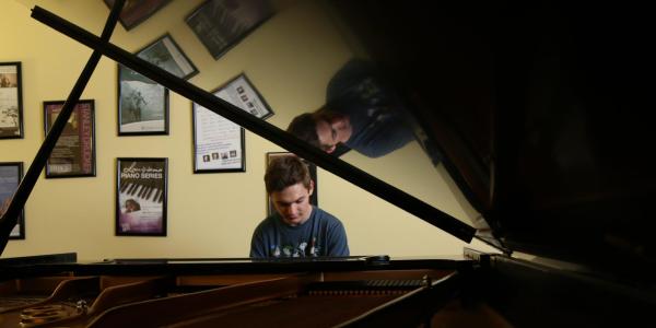 Student playing piano