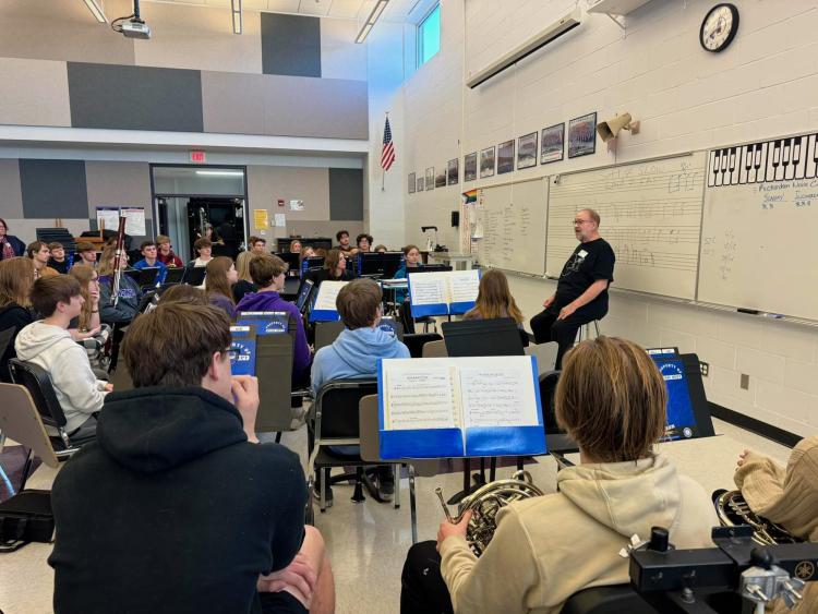 McKee speaks with the Indianola High School Wind Ensemble sharing stories and life advice. Photo courtesy: Indianola High School Band.