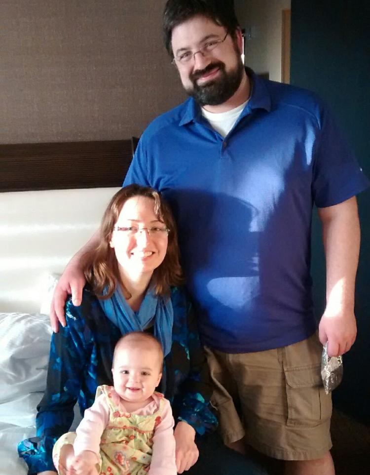 adam and sasha with their daughter