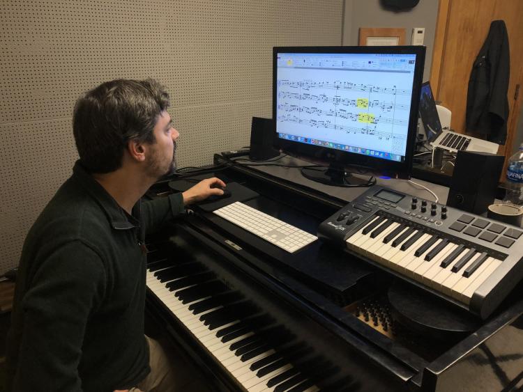Associate Professor of Composition Carter Pann works on the new equipment in his office, purchased with help from the new Christoffersen Faculty Fellowship in Composition.