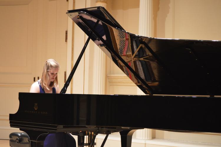 grace burns on stage at carnegie