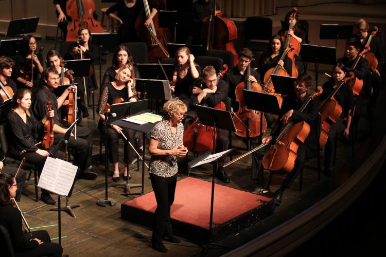 Jamie Bernstein on stage with the CU Symphony
