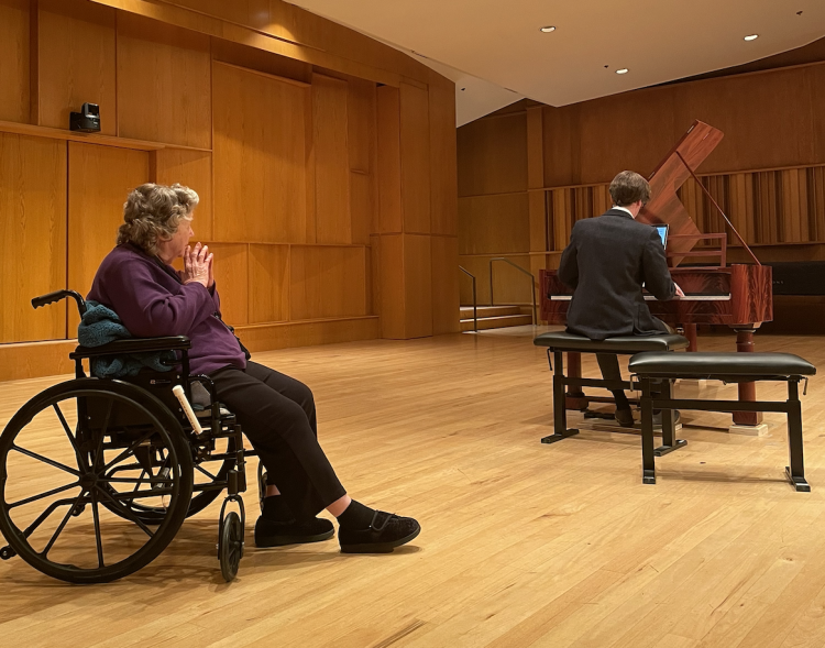 Avlona Taylor enjoying Wes Leffingwell's performance on the refurbished fortepiano up close.