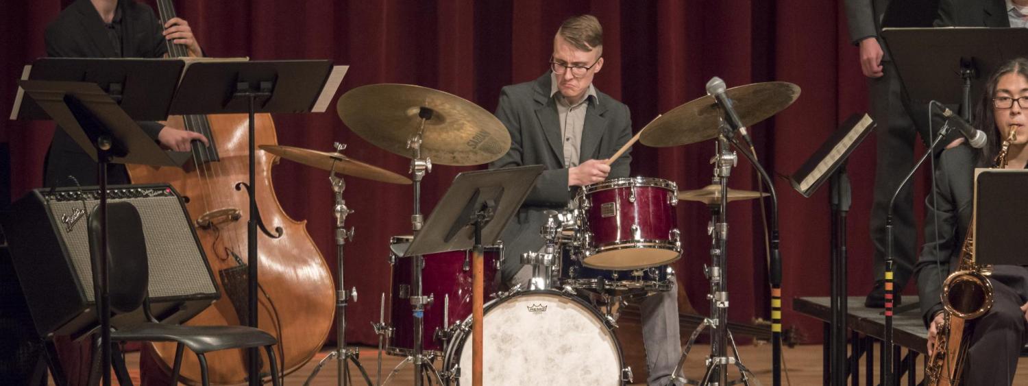 Jazz drum student in performance in ensemble