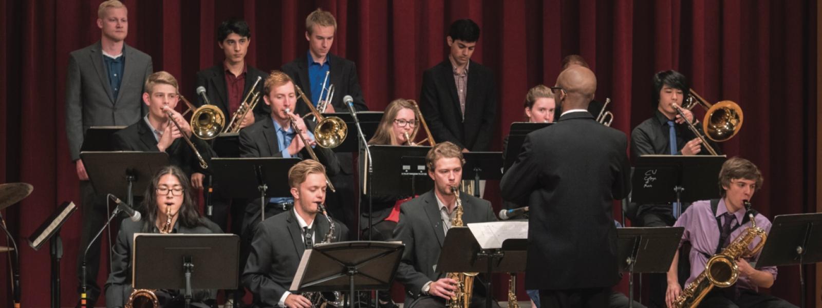 Music education student conducting jazz ensemble