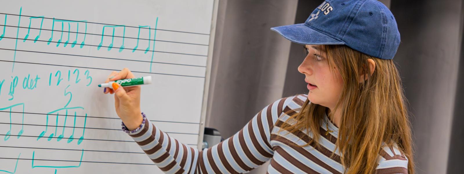 Music education student at whiteboard