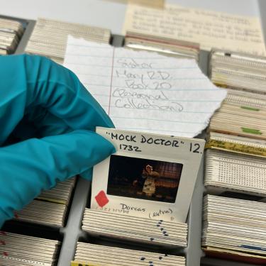 Howard sifting through the boxes of photo slides