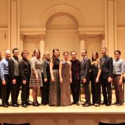 group on stage at carnegie hall