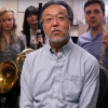 yoshi and a group of students sitting in his office