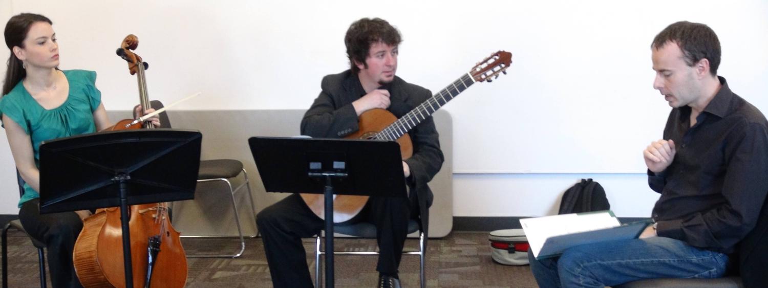 Guitar students working with teacher
