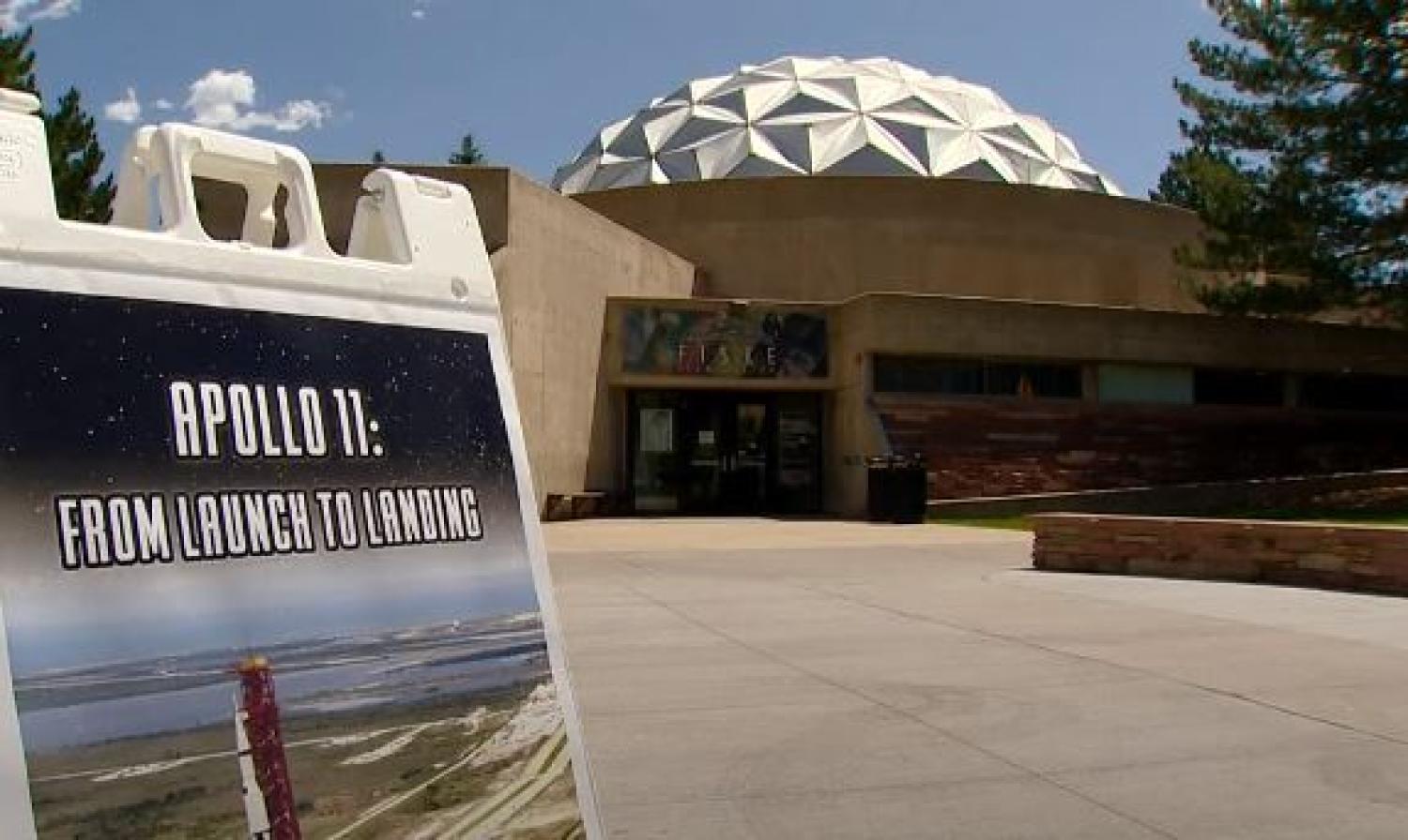 Fiske Planetarium with Apollo 11 poster in foreground
