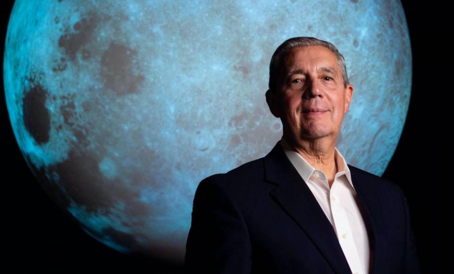 Photo of Jack Burns with SOS Moon in the background