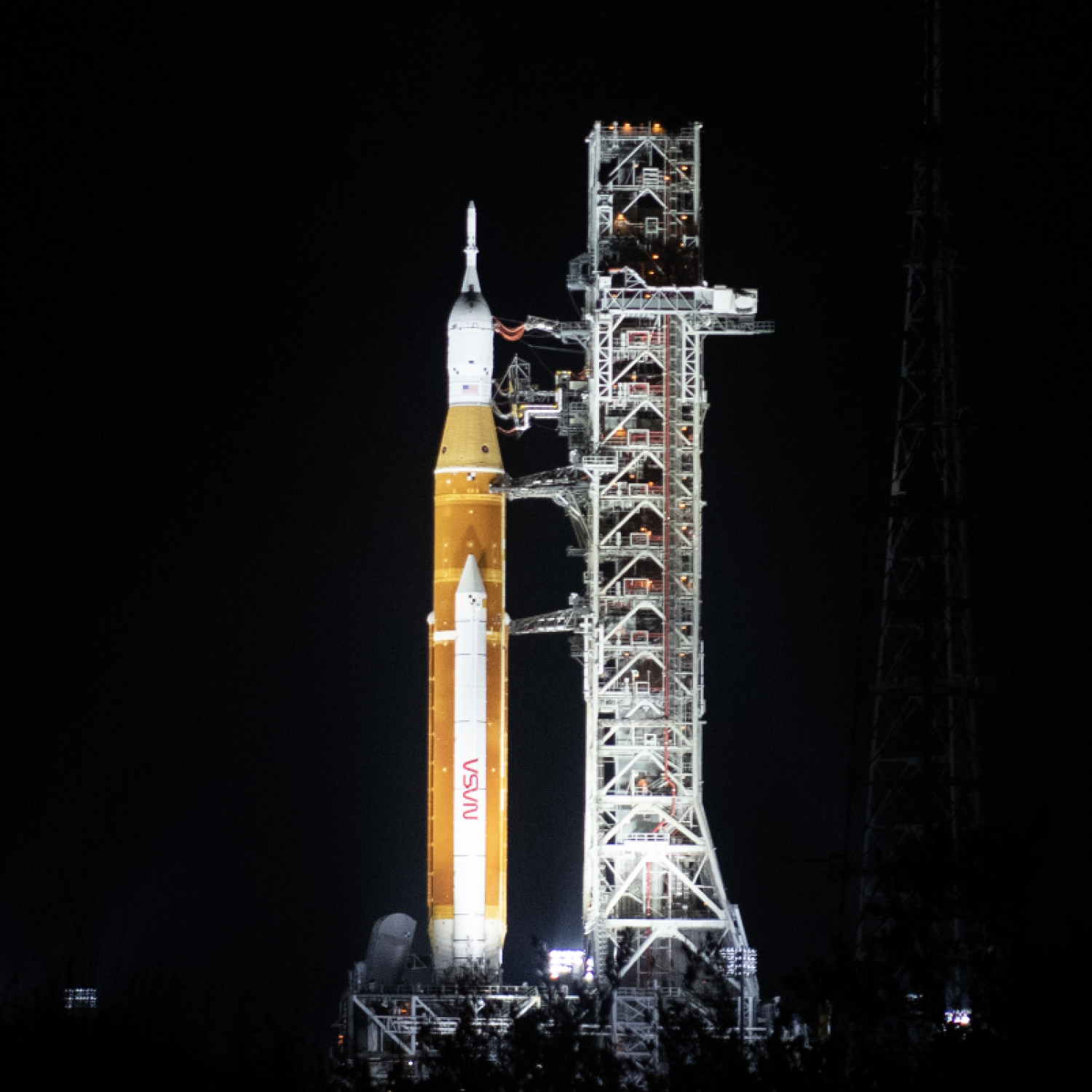 Photo of NASA's Artemis on launch pad in November 2022. Photo taken during night with rocket with spotlights.