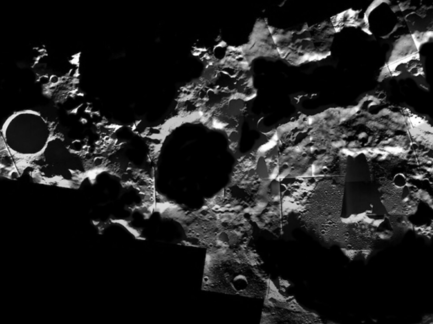 Shadows stretch across the moon's South Pole in this mosaic image. (Credit: ESA/SMART-1/AMIE camera team; image mosaic: M. Ellouzi/B. Foing)