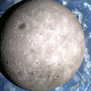 Photo of the far side of the Moon with the earth in the background