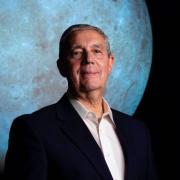 Photo of Jack Burns with SOS Moon in background