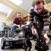 Seniors Benjamin Mellinkoff, left, and Matthew Spydell are getting their robot arm to work in their lab at the University of Colorado's Boulder campus on Wednesday.