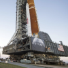 NASA employees take photos as NASA's Space Launch System (SLS) rocket with the Orion spacecraft aboard is rolled out of High Bay 3 of the Vehicle Assembly Building for the first time, at the Kennedy Space Center in Cape Canaveral, Fla.