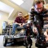 Seniors Benjamin Mellinkoff, left, and Matthew Spydell are getting their robot arm to work in their lab at the University of Colorado's Boulder campus on Wednesday.