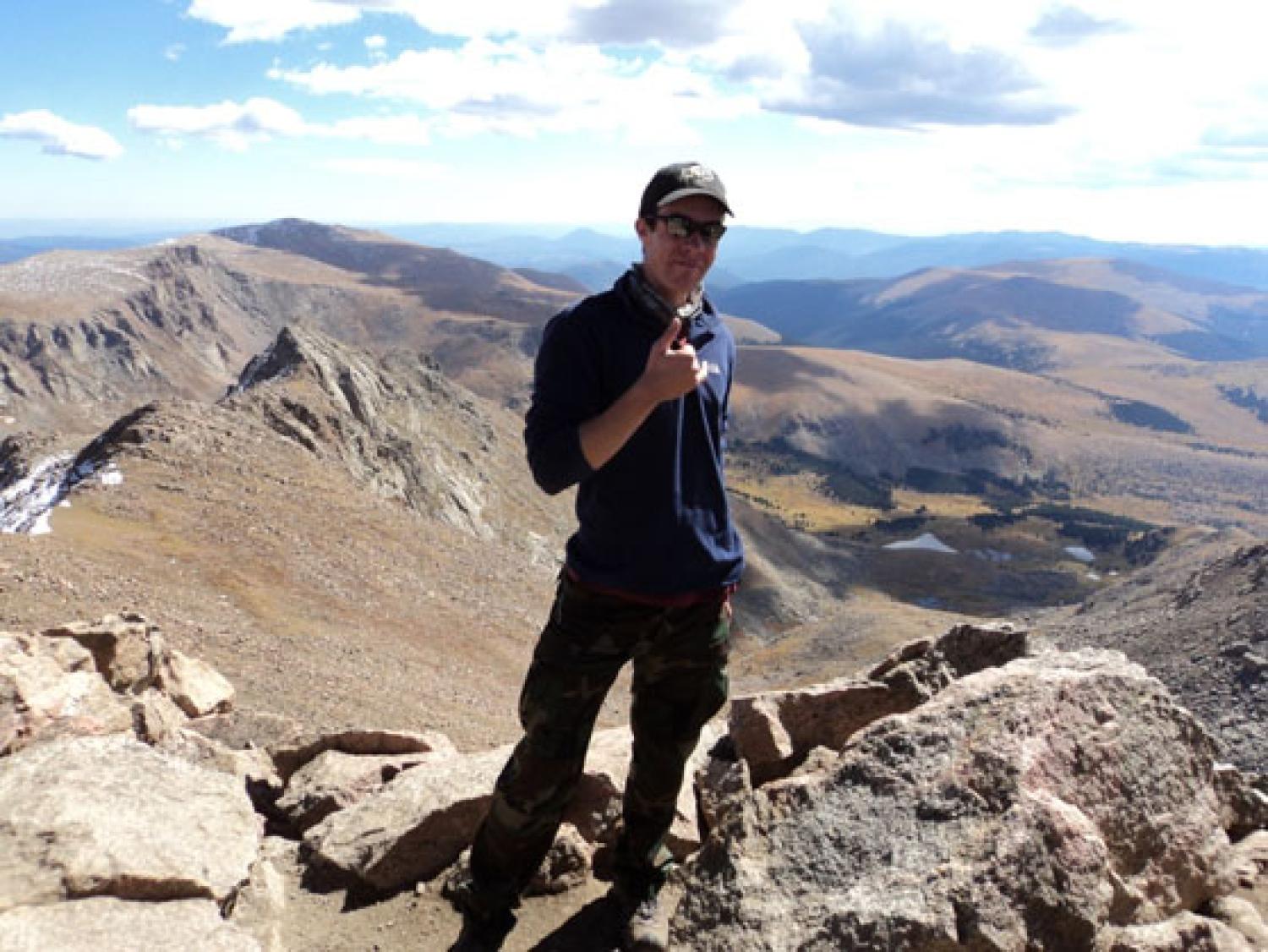 a grad student at the top of the mountain
