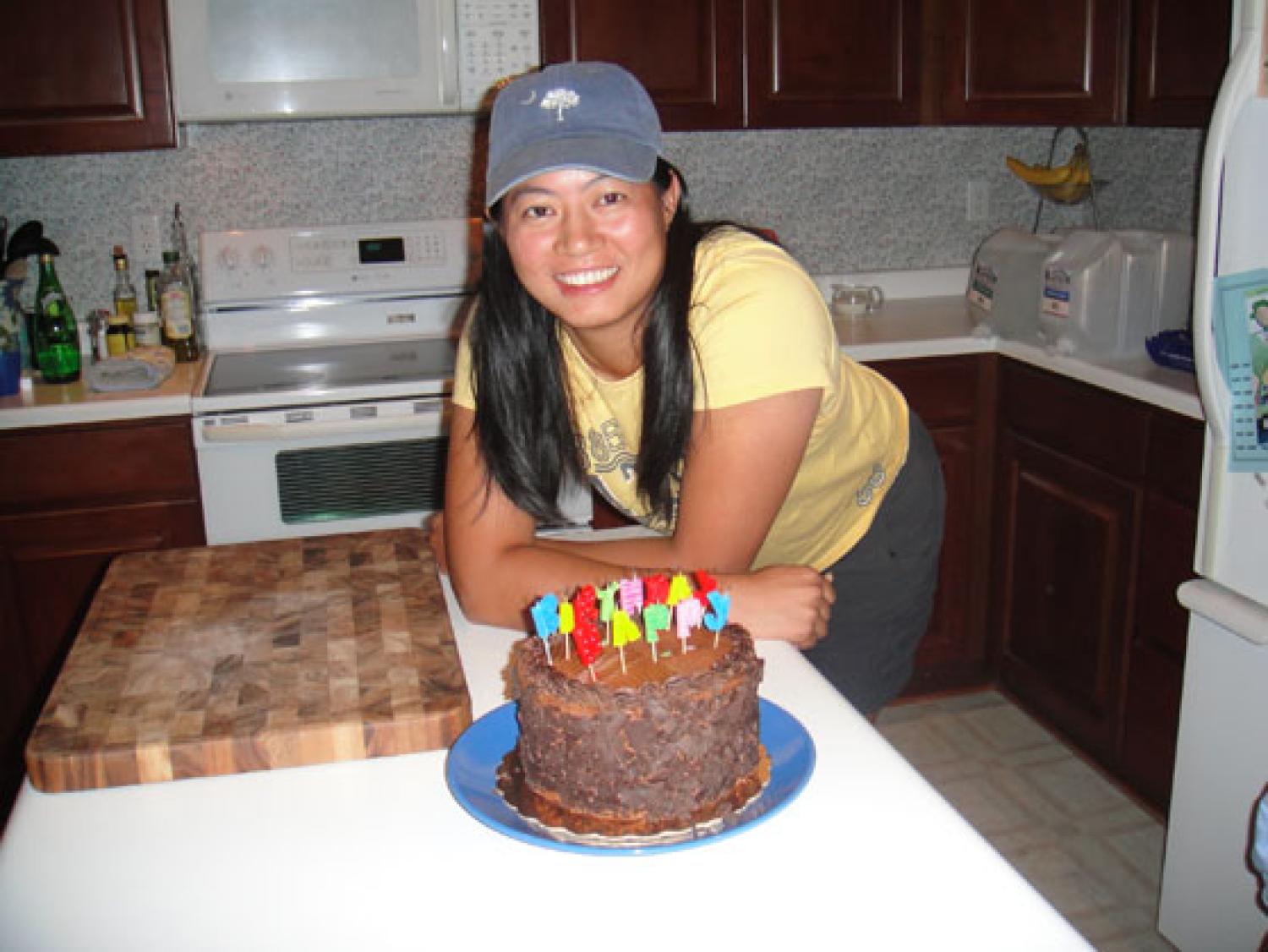 Helen posts with her birthday cake