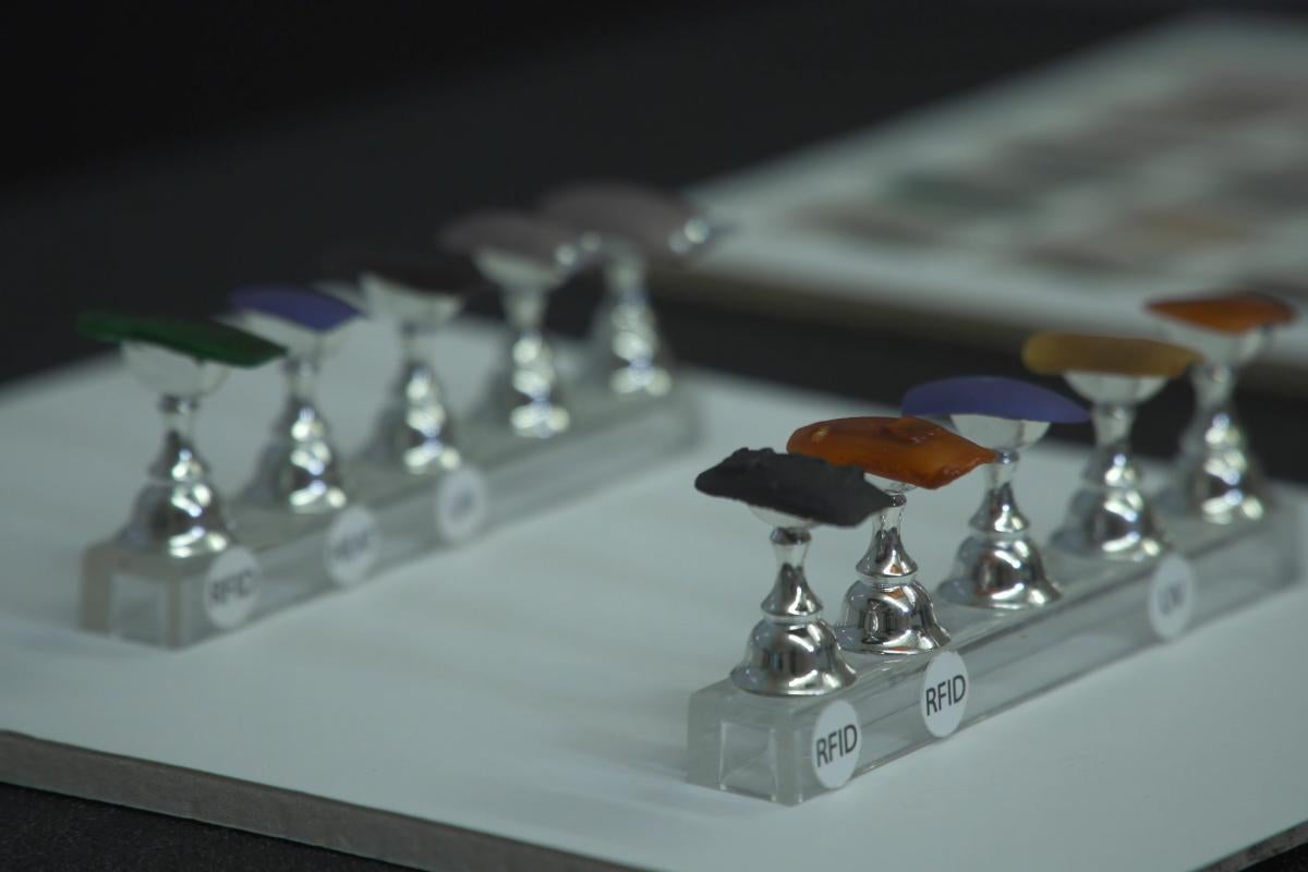 Press-on nails, made with sustainable materials instead of plastic, on display on a table.