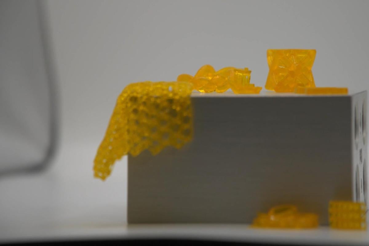 A variety of yellow, flexible materials displayed on a lab table.