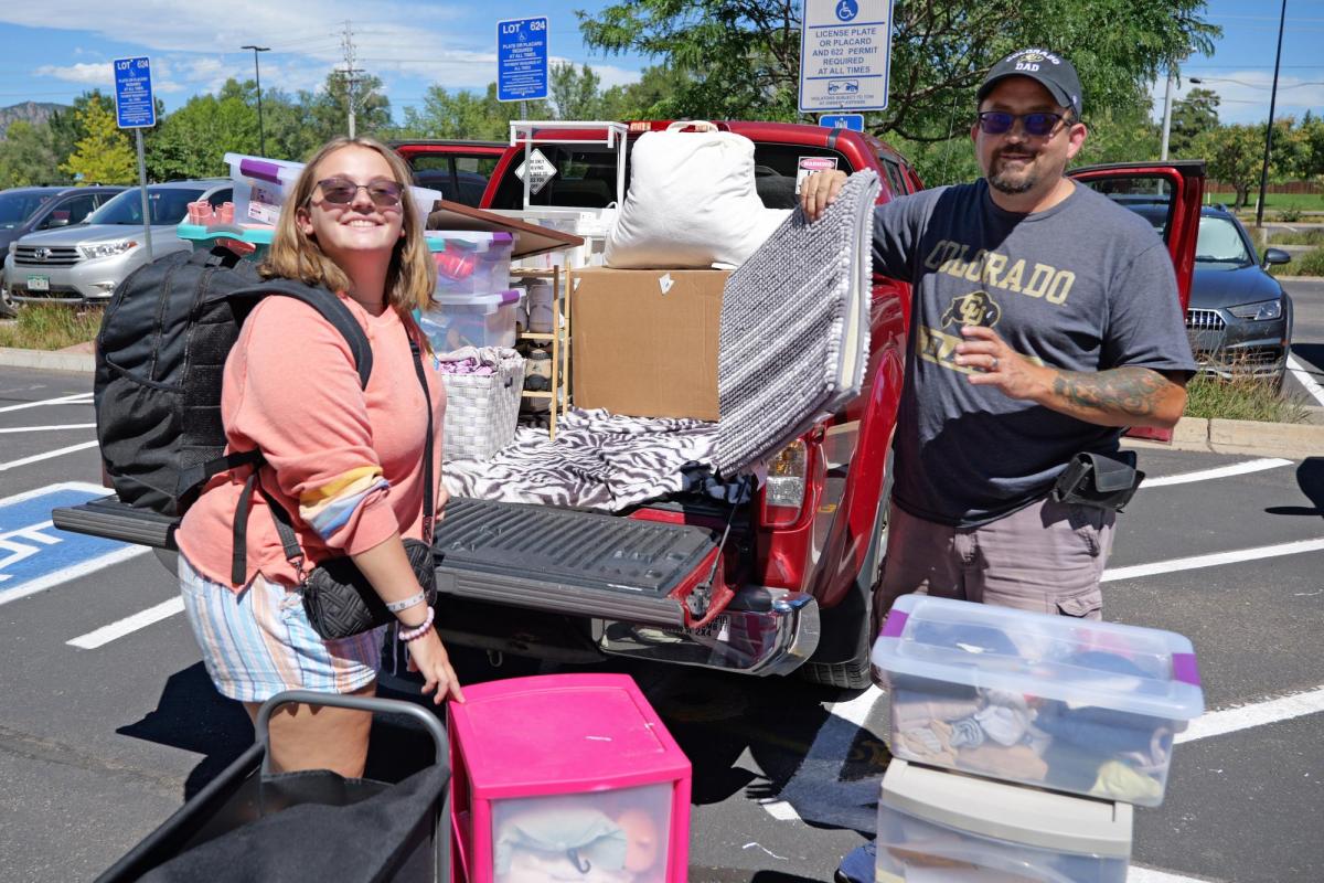 smiling parent and student on move-in day.