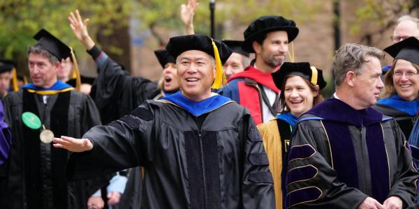 Daryl Maeda, associate dean for student success, joins graduates and faculty in the procession at the 2023 Spring Commencement