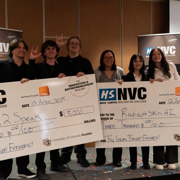 Winning teams Sign 2 Speak and RadiantSkin AI holding their checks at the HSNVC 2025 Finals