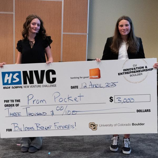 Winning team Prom Pocket holding their check at the HSNVC 2025 Finals