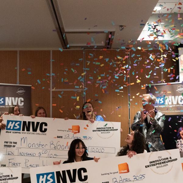 HSNVC 2025 winning teams holding their checks under a shower of confetti