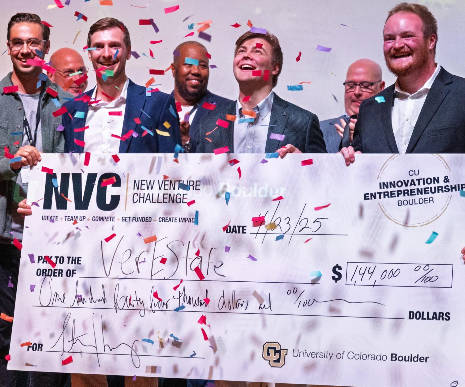 Kickstart principal Matt Smith hands the VerEState team their winning check