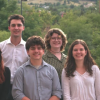 Team of young engineers poses for a picture