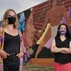 Allyson Burbeck and Lucha Martinez pose in front of the La Alma (The Soul) mural created by Emanuel Martinez and located at the La Alma Recreation Center in Denver.