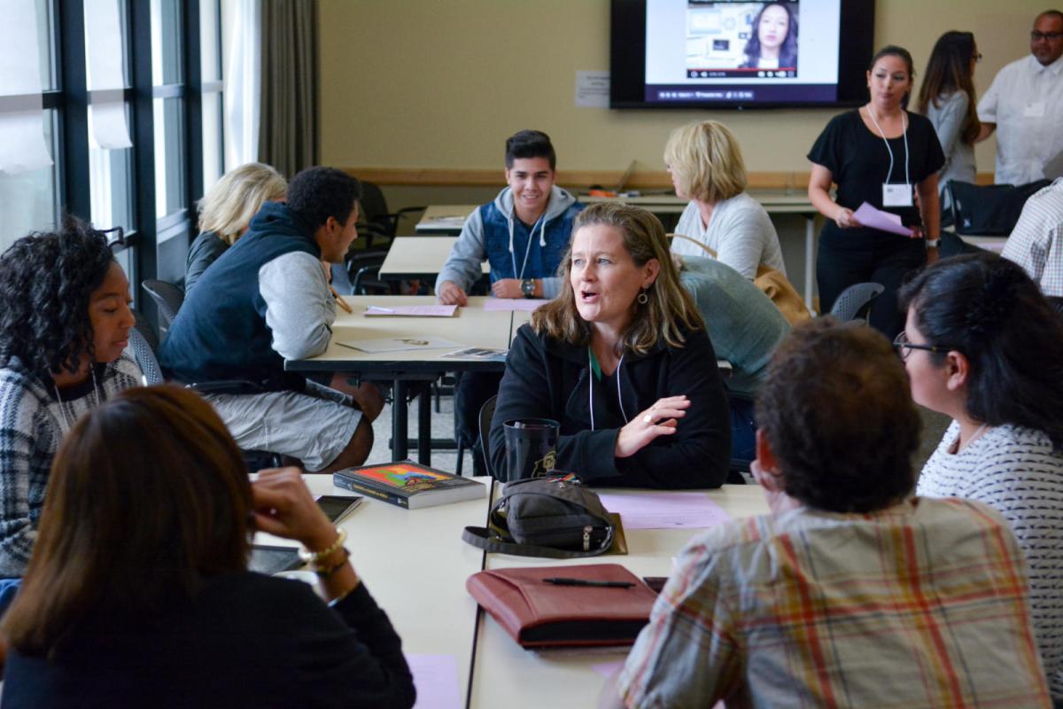 Faculty member meeting with students
