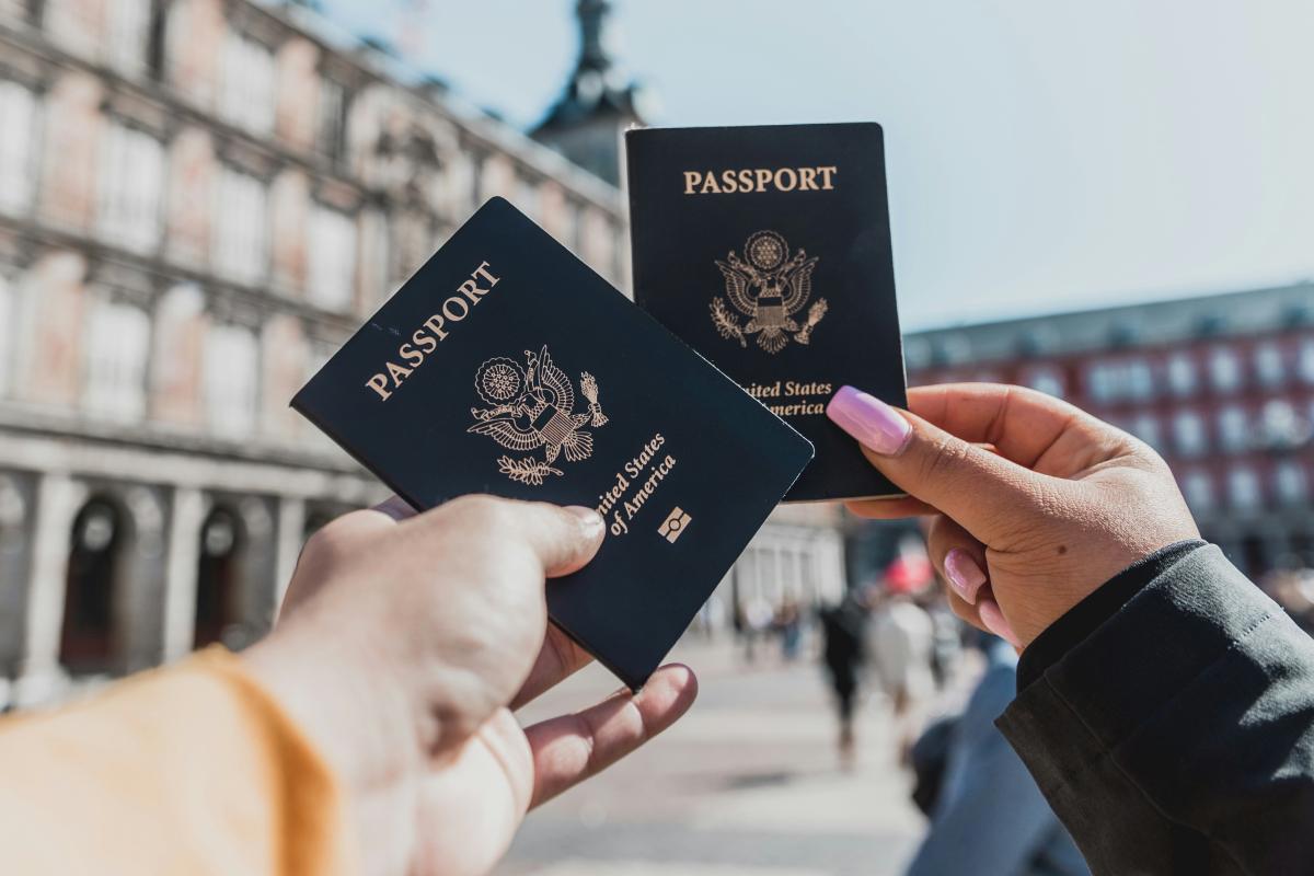 Passports held by hands