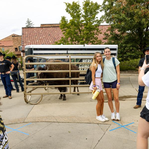 students taking photos with Ralphie