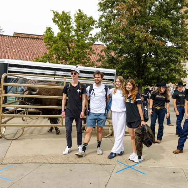 students taking photos at homecoming event