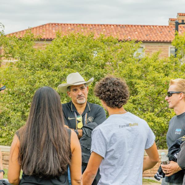 students talking to Chancellor