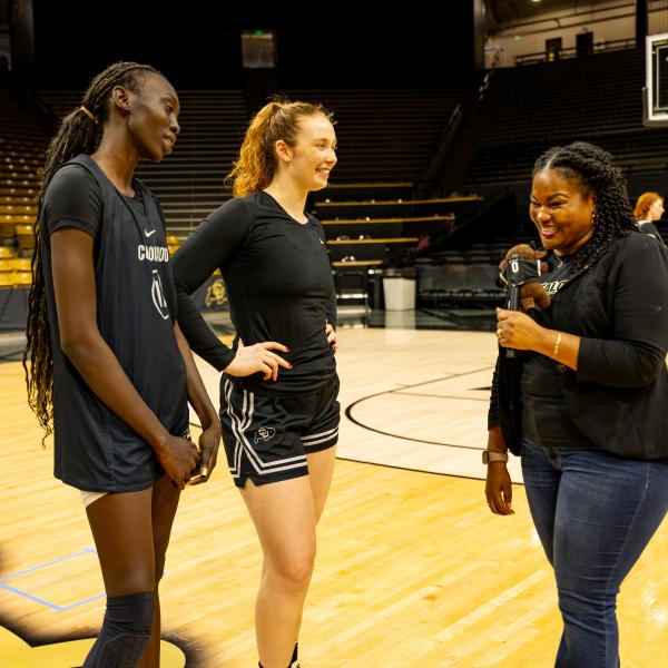 Dr Mull with women's basketball players
