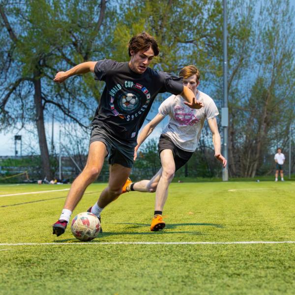 Students playing soccer