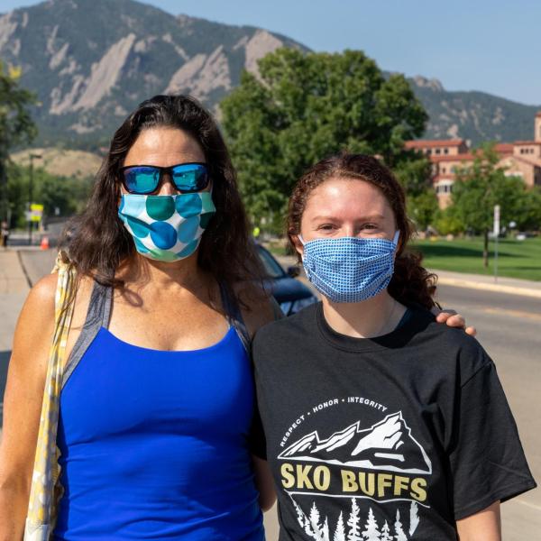family in front of flat irons