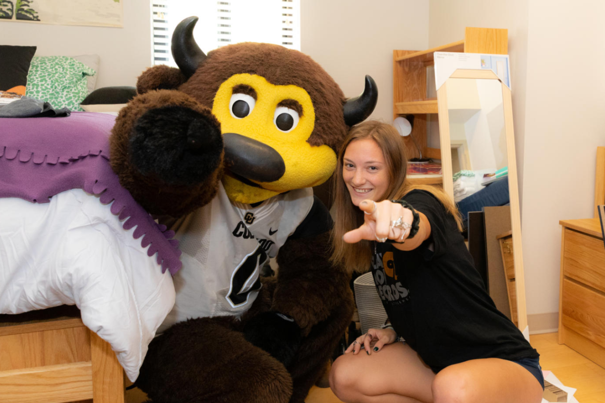 chip and student in residence hall