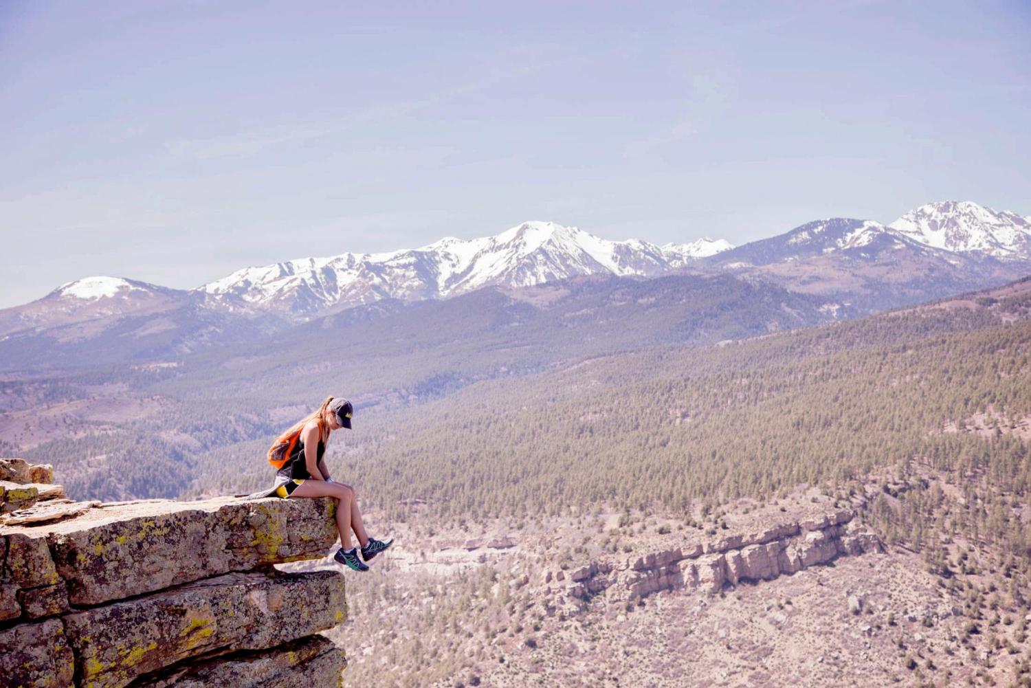 woman on top of a mountain