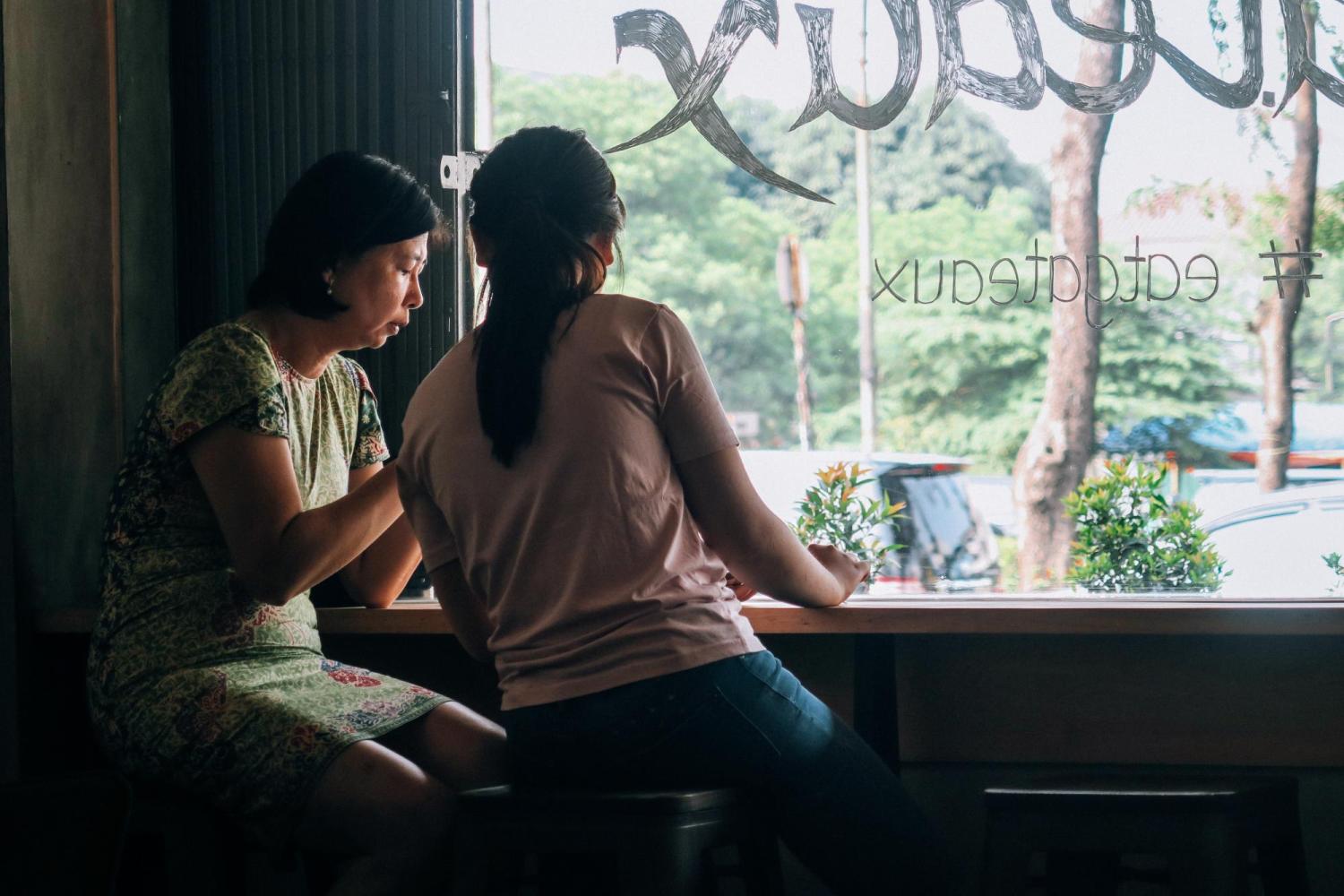 A mother and daughter having a conversation